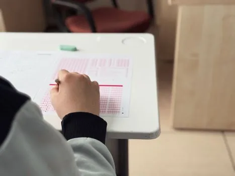 Korean education office application counter with exam documents, ID photo and receipt checklist, no visible logos, documentary editorial photo | 수능 응시원서 현장 접수 준비 이미지