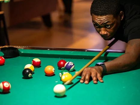 professional carom billiards table in a Korean indoor sports arena, team benches and broadcast cameras, energetic but clean editorial photo style