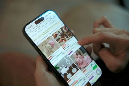 delivery app order screen beside official food safety website search notes, user comparing restaurant address before ordering, realistic Korean home desk