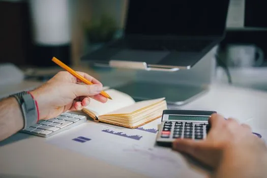 Korean apartment applicant checking ApplyHome deadline calendar and housing subscription papers on laptop, realistic daylight desk, no readable private data | 청약홈 신청 마감시간을 확인하는 장면