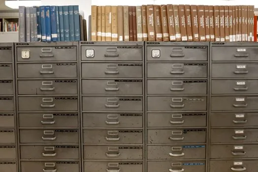 Korean diplomatic office desk with sealed documents, muted peninsula map, humanitarian case file mood, no personal data | 북한군 포로 한국행 논의를 설명하는 외교 문서 장면