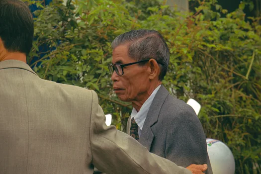 Korean political reporters waiting outside a government hearing preparation office, documentary news style, no text