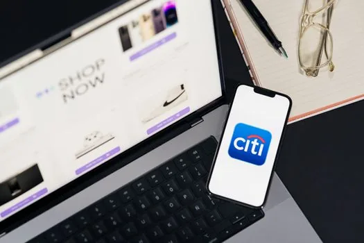 Korean user checking account security emails and phone settings, official help page on laptop, no brand logos, realistic editorial photo | 해킹 의심 신호와 계정 보안 메일을 확인하는 장면